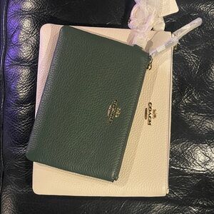 Two pouches. Never used. Hunter green and cream